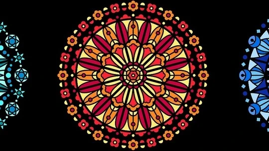 Circular mandala design with concentric layers of yellow, orange, and red floral and geometric patterns on a black background