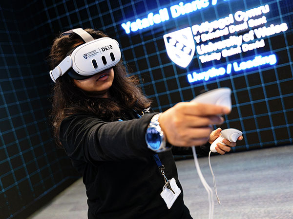 UWTSD Student Wearing Headset