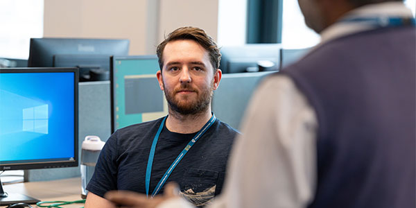 Classroom with computer male looking at lecture